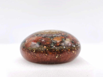 Orgonite Galet - Graine de Vie, Cornaline, Pyrite.